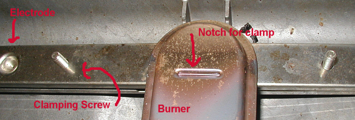 closeup of burner and lighter / bracket assembly